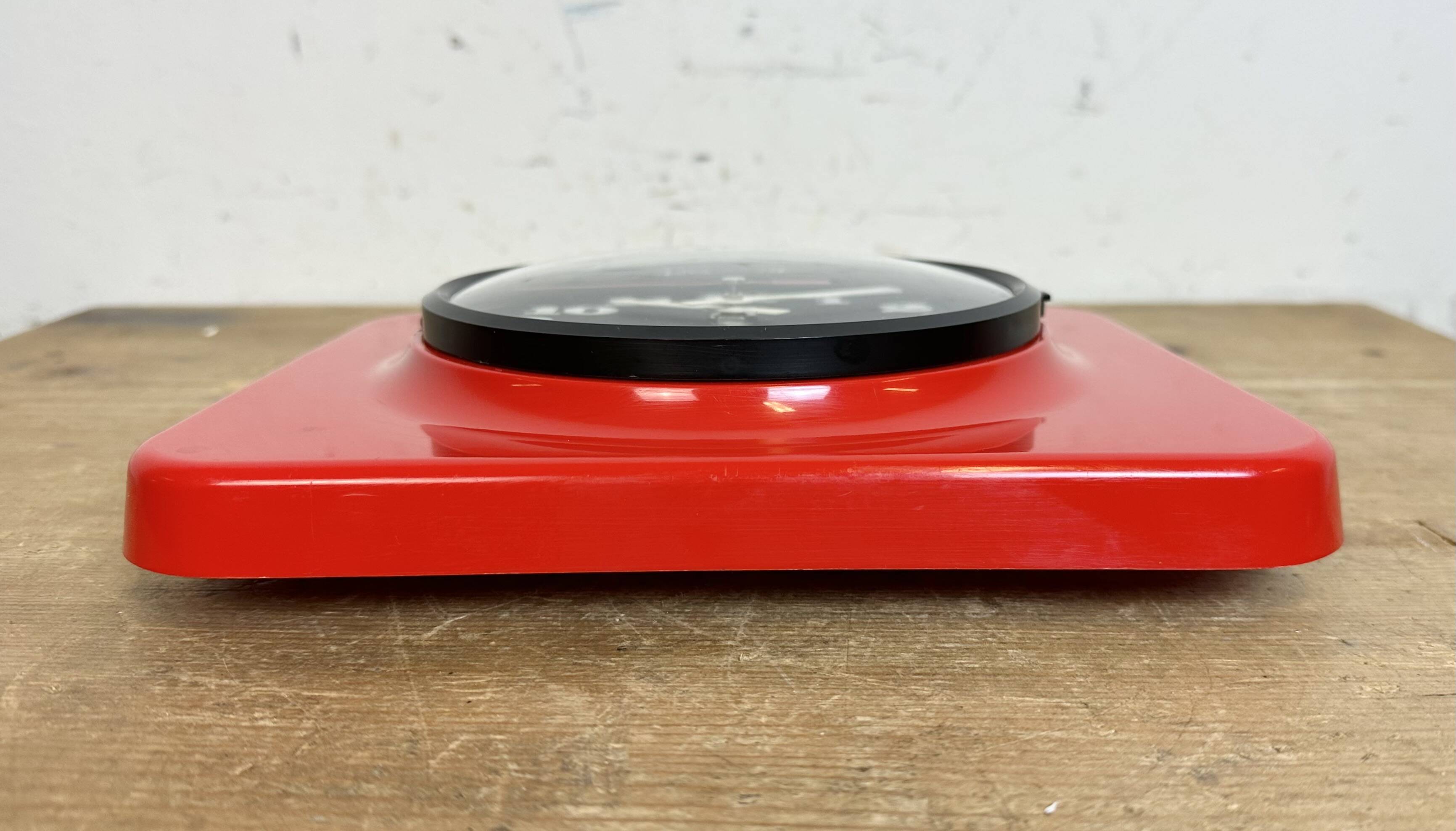 Vintage red bakelite wall clock from prim, 1970s