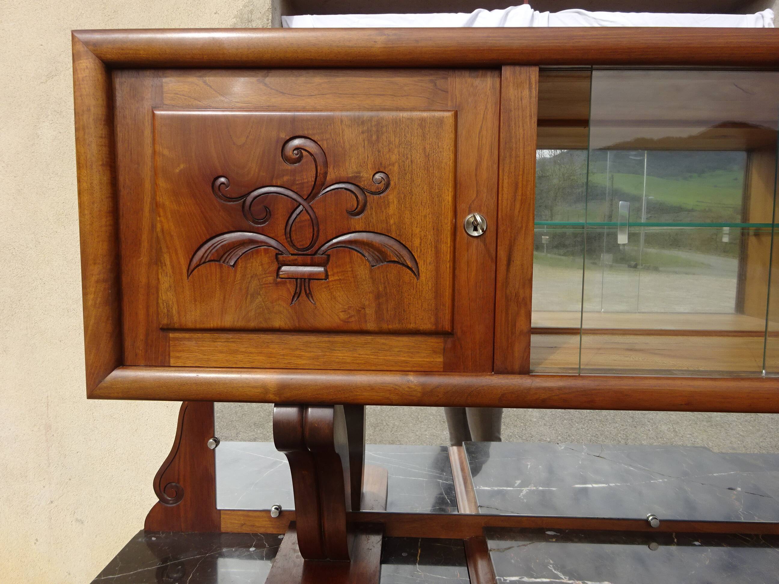 Solid walnut sideboard, moustache legs, black marble top.