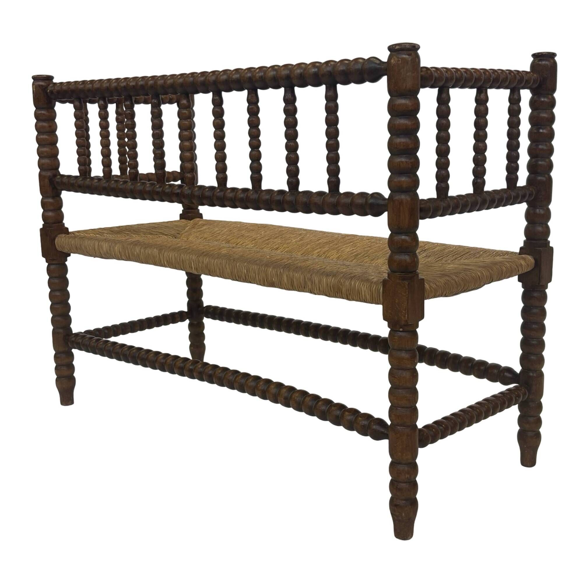 Vintage 'bobbin' bench with a rush seat, 1920s design with armrests.