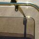 Golden metal and smoked glass dessert table