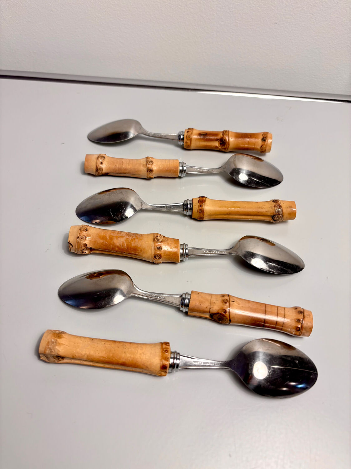 Set of 6 vintage dessert spoons with bamboo handles.