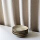 7 speckled stoneware plates