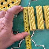 2 yellow ceramic trivets and knife rests