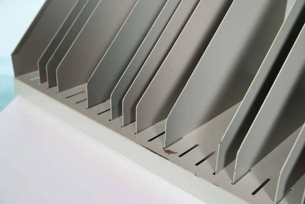 Vintage 1960s metal magazine rack, storage for single LPs.