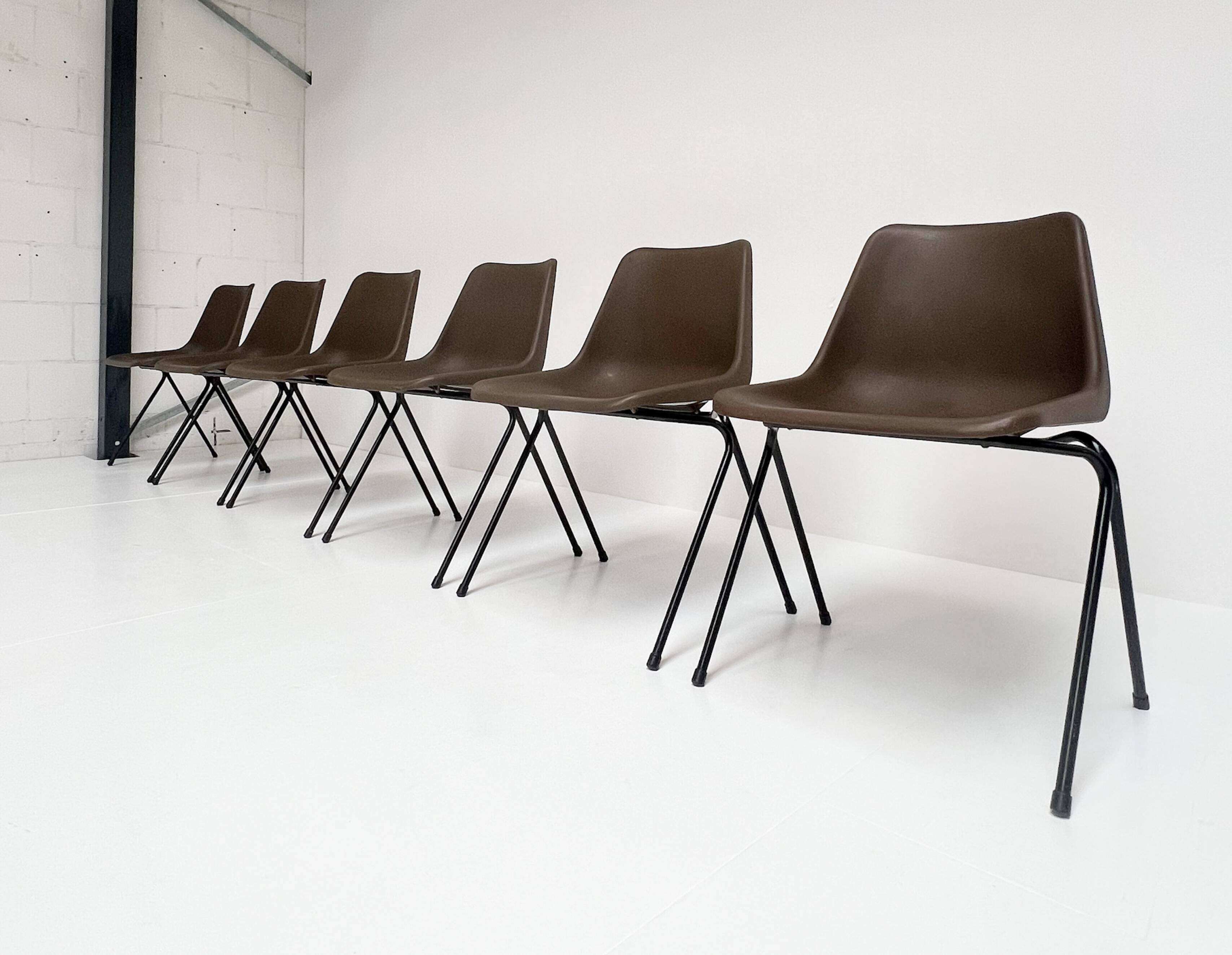 Brown and black set of 6 Polyprop chairs on a metal frame. The Polyprop cha