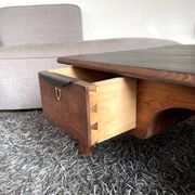 Wooden coffee table with black top