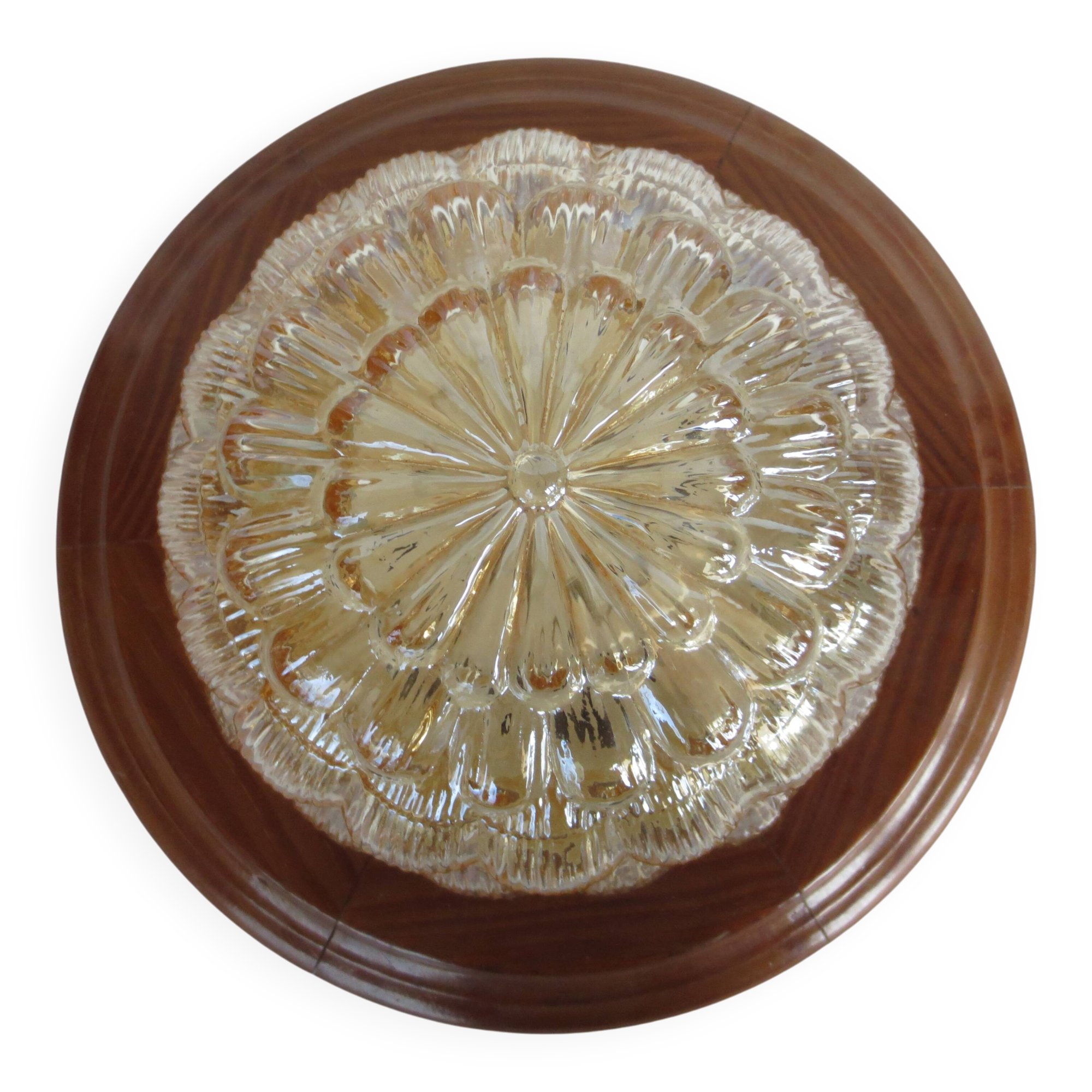 ceiling light with amber glass globe, on a round light wood base
