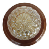 ceiling light with amber glass globe, on a round light wood base