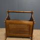 Wooden magazine rack with cane work