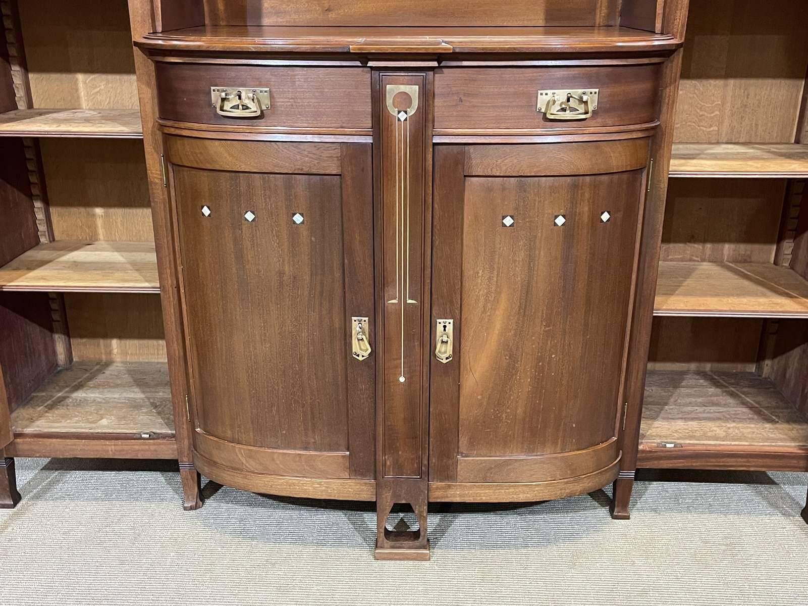 Art Nouveau mahogany buffet with clock in the style of G. Serrurier Bovy.