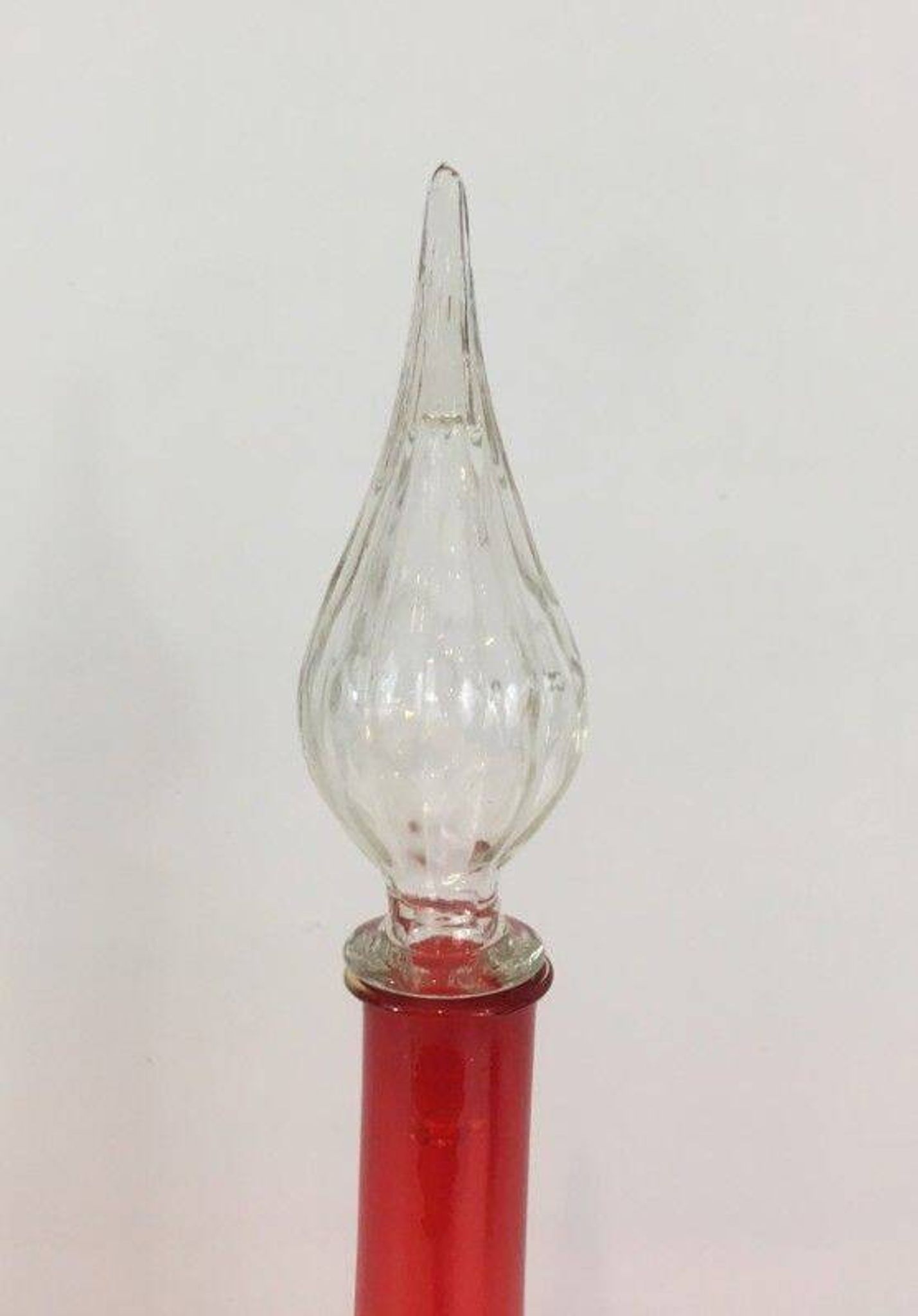 Large designer bottle in red glass