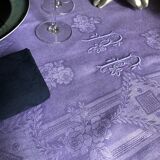 Old damask tablecloth in linen and purple silk