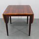 1960s Danish extendable palisander dining table, 4 leaves, restored