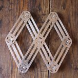 Vintage accordion folding metal trivet