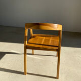 Natural wood chair with wraparound back