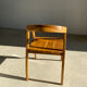 Natural wood chair with wraparound back