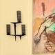Pair of sculpted lacquered bronze wall lights, Arlus