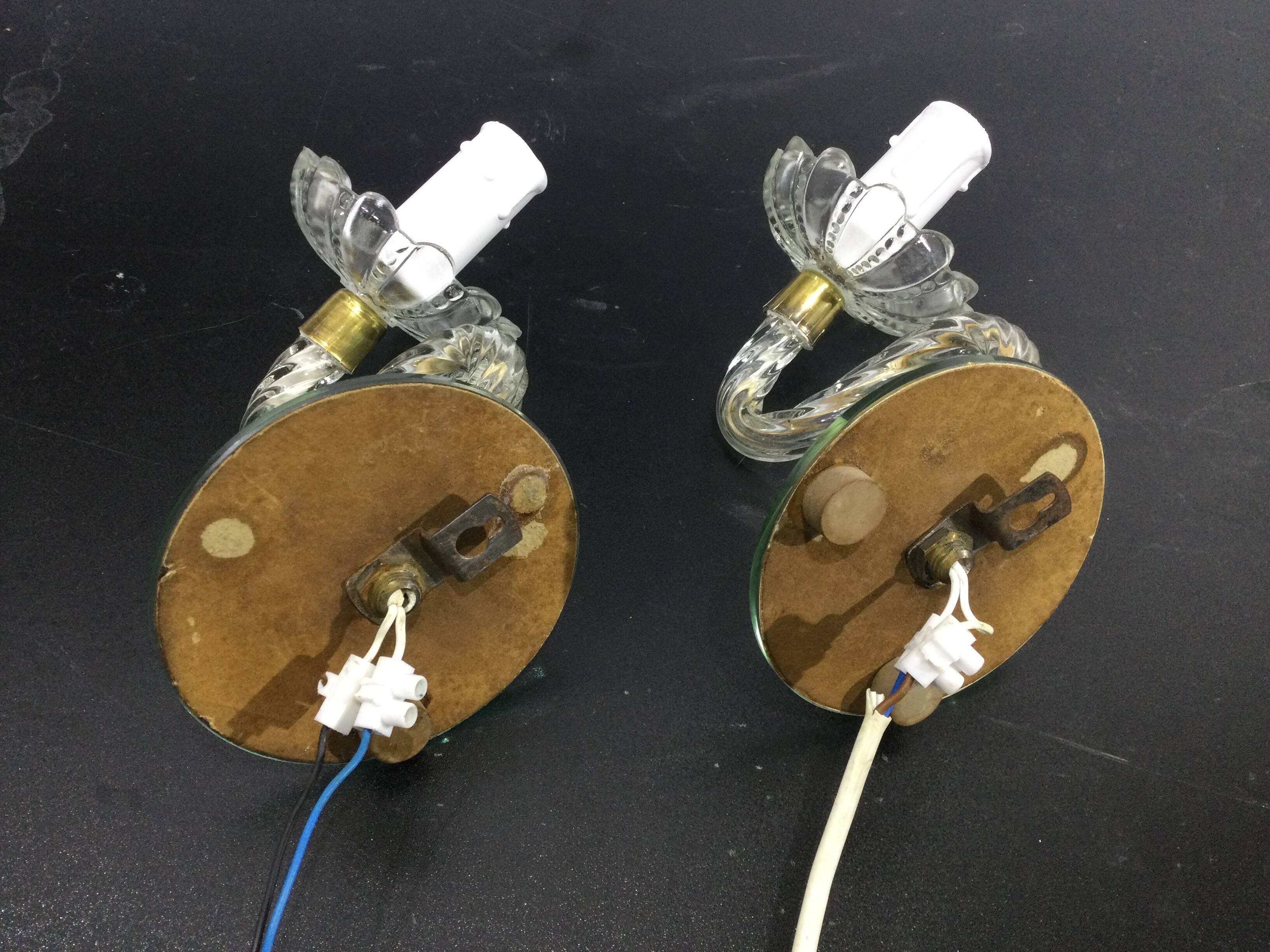 Pair of glass and mirror sconces