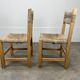 2 straw and wood chairs in brutalist style