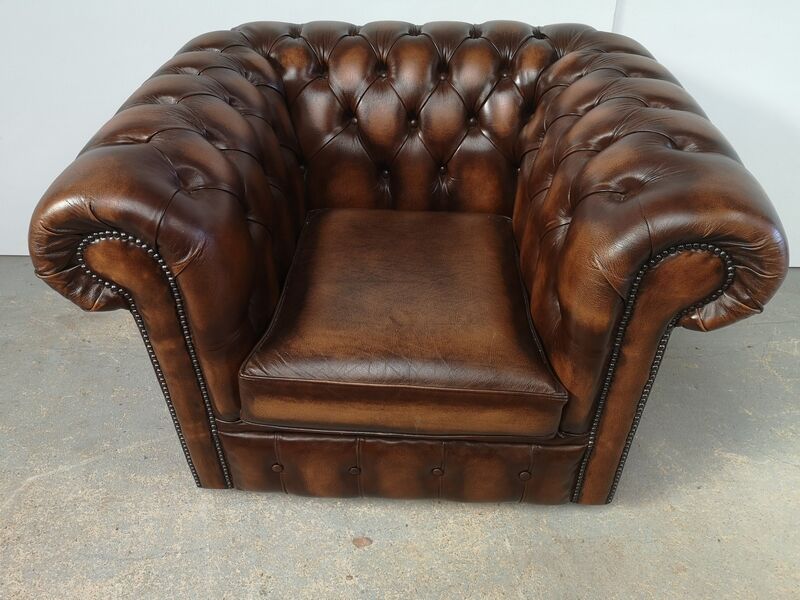 Brown leather chesterfield armchair