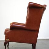 Elegant, smooth, and comfortable English Chesterfield wingback armchair in a beautiful classic color