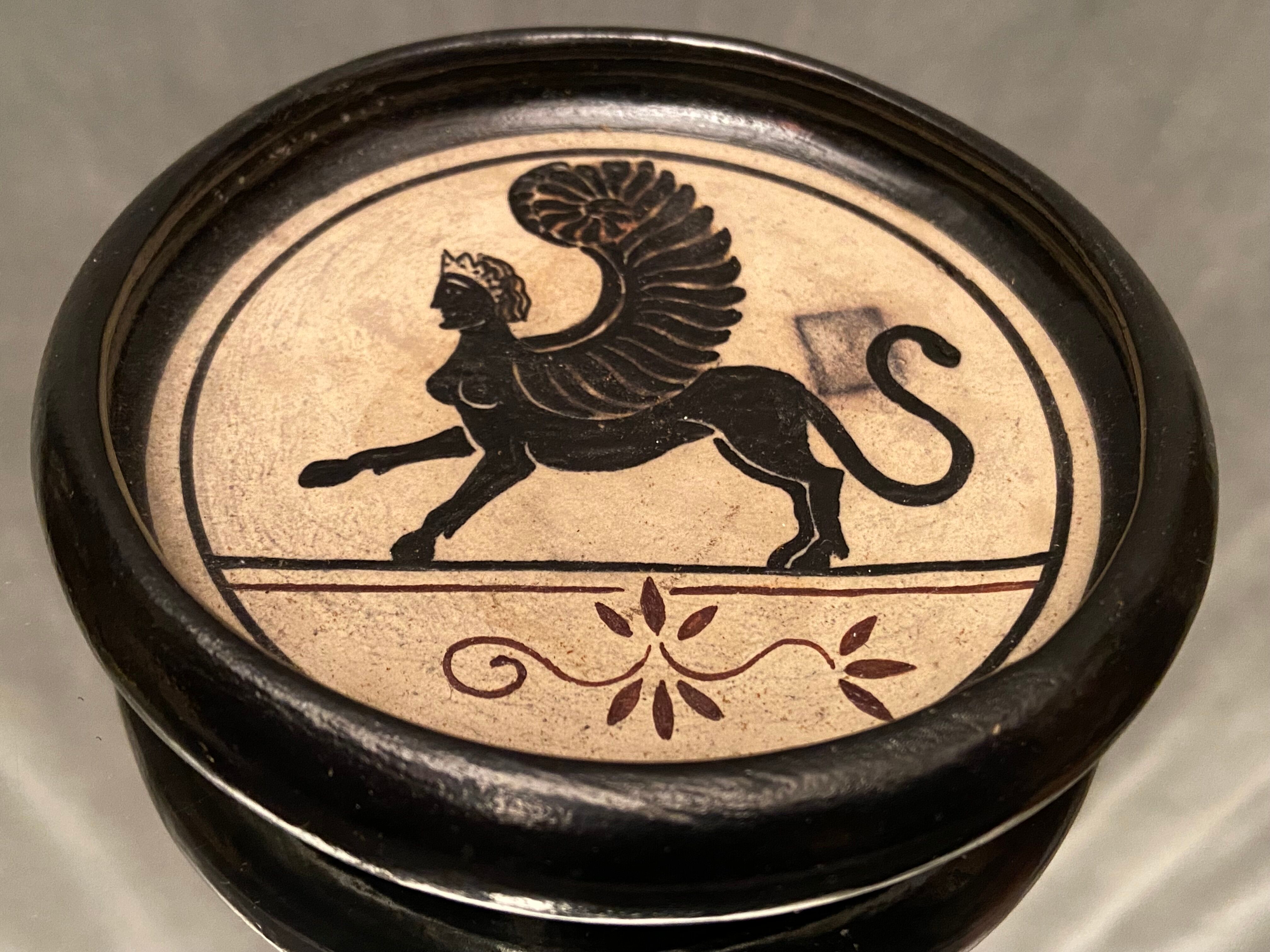 Cup decorated with winged sphinx in Ciboure sandstone signed Marie Fernandez