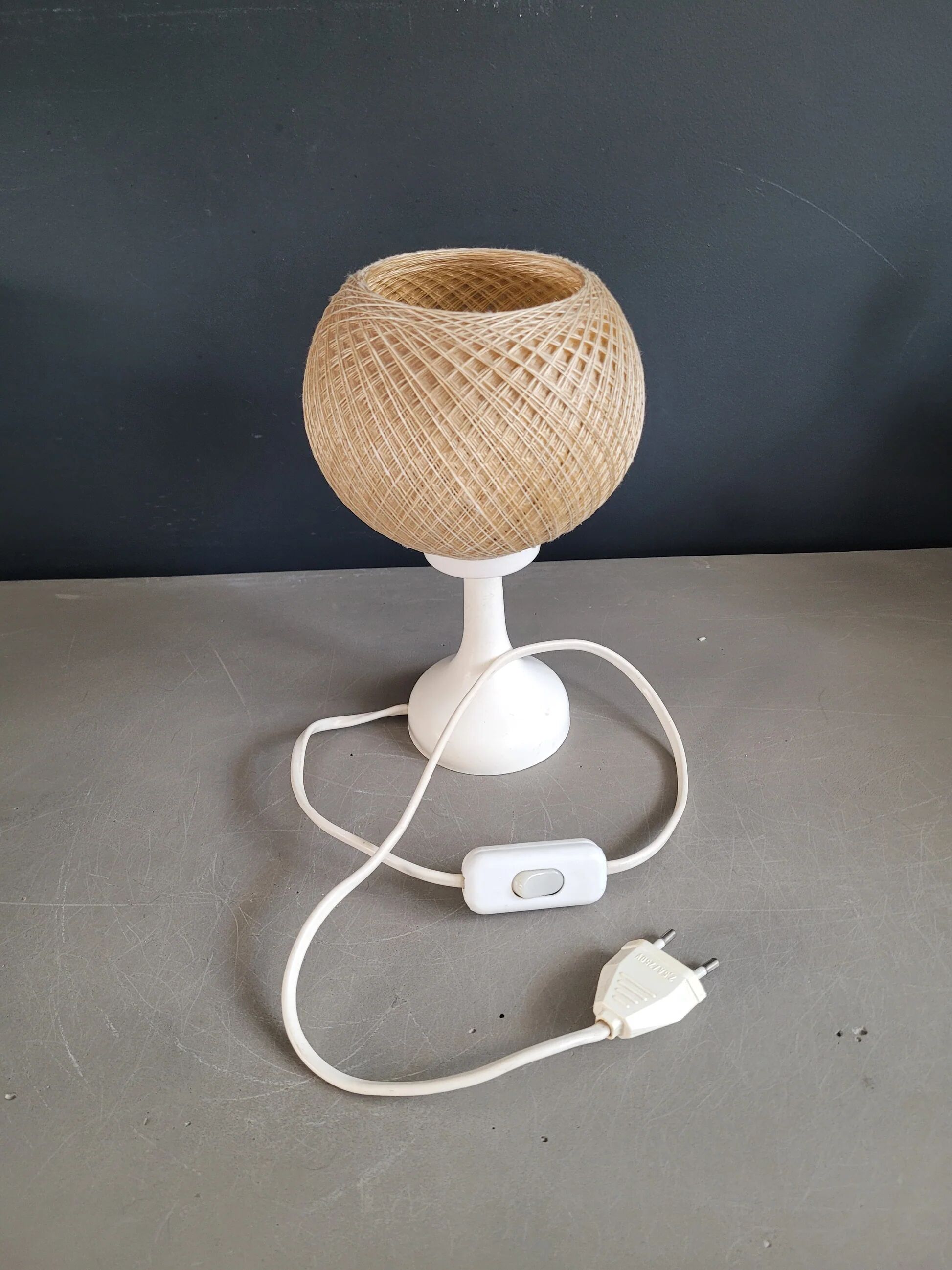 60's table lamp with tulip base and stretched wire shade.