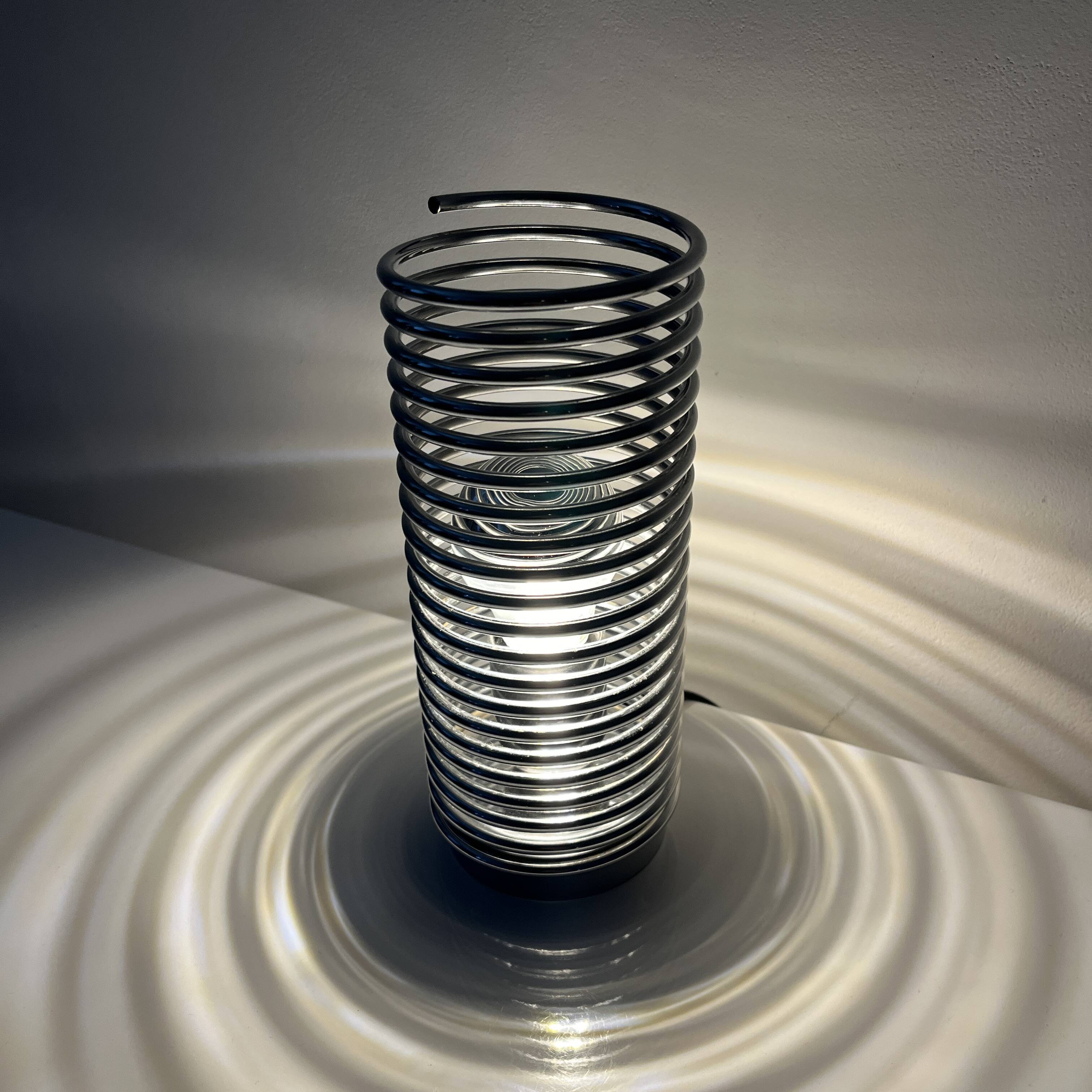 Massive chrome spring lamp