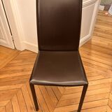 Many brown leather chairs "Roche Bobois"