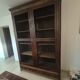 Library in marquetry with a grille from the Louis XVI period.