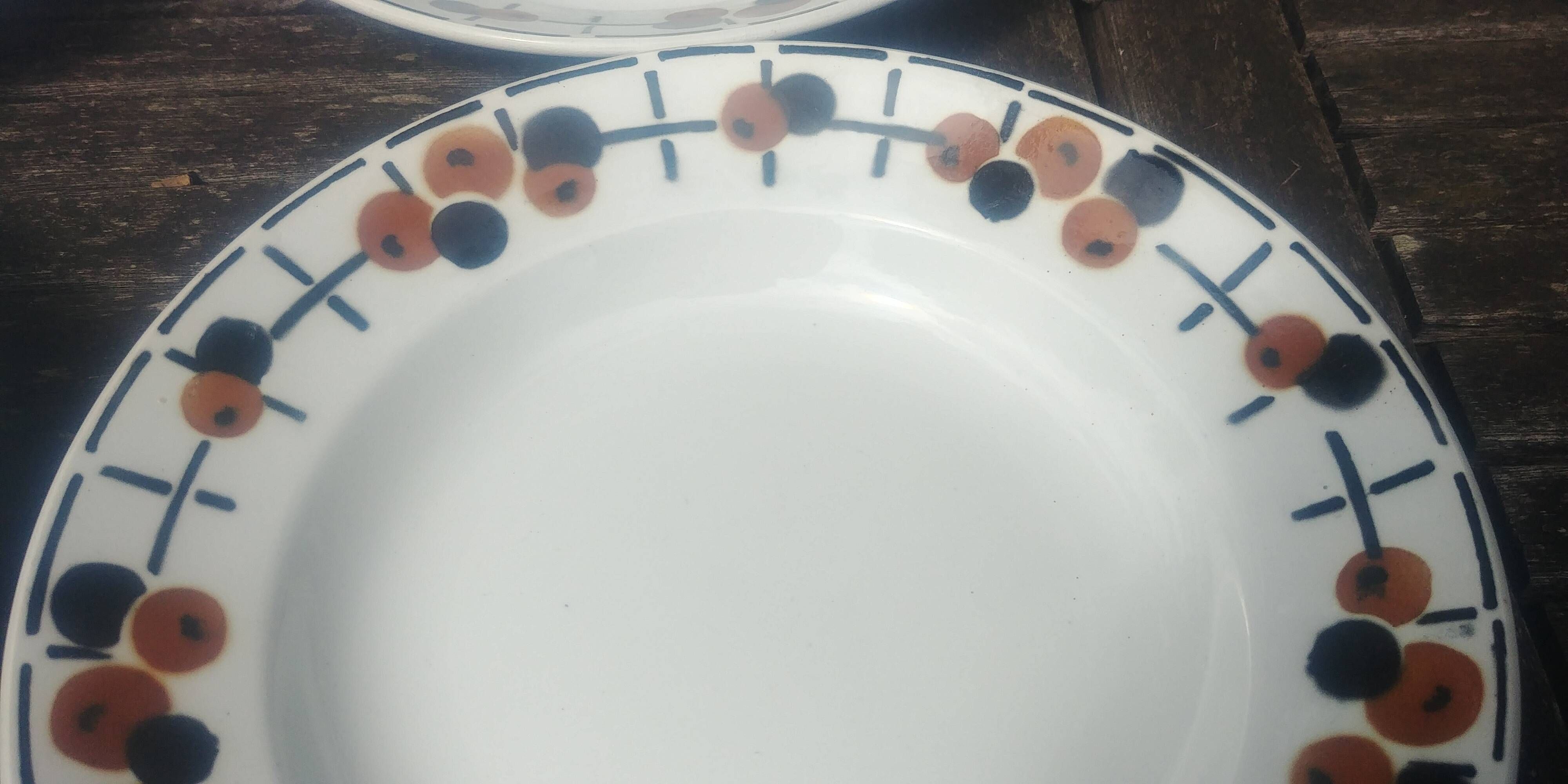 Set of eight ironstone soup plates from the Saint Amand earthenware factory