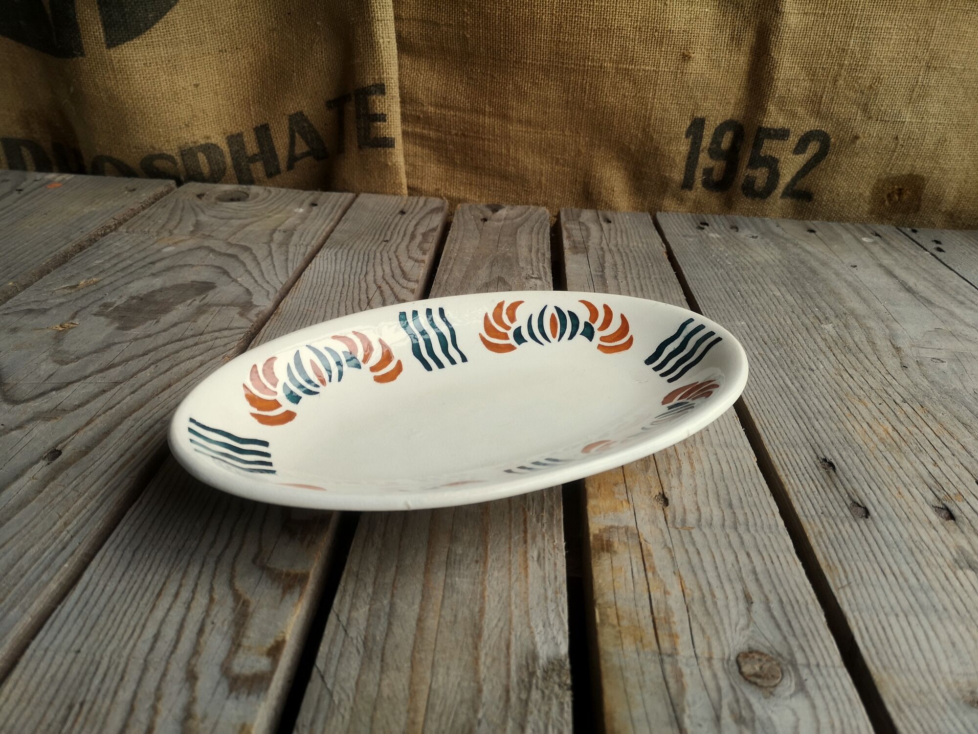 Dish out of ceramics decor orange and green