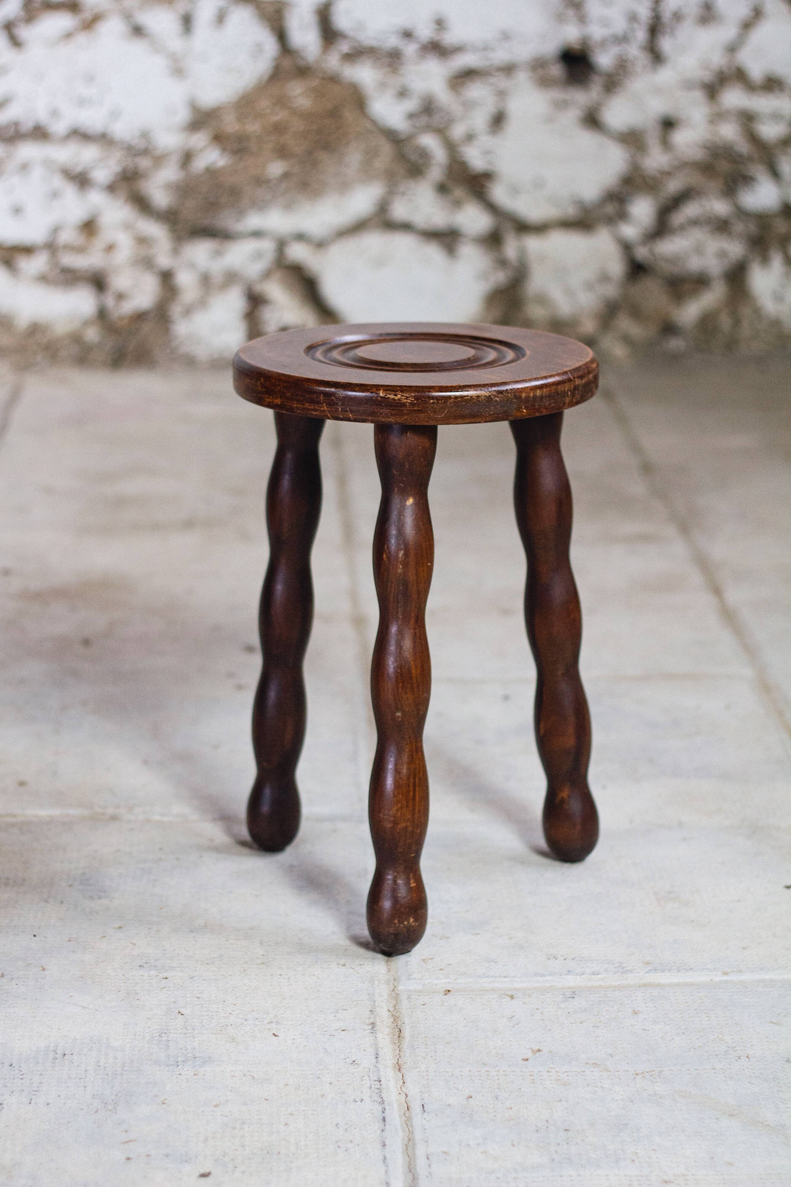 Tripod stool in turned wood in the style of Charles Dudouyt, 1950