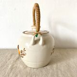 Vintage porcelain and rattan teapot