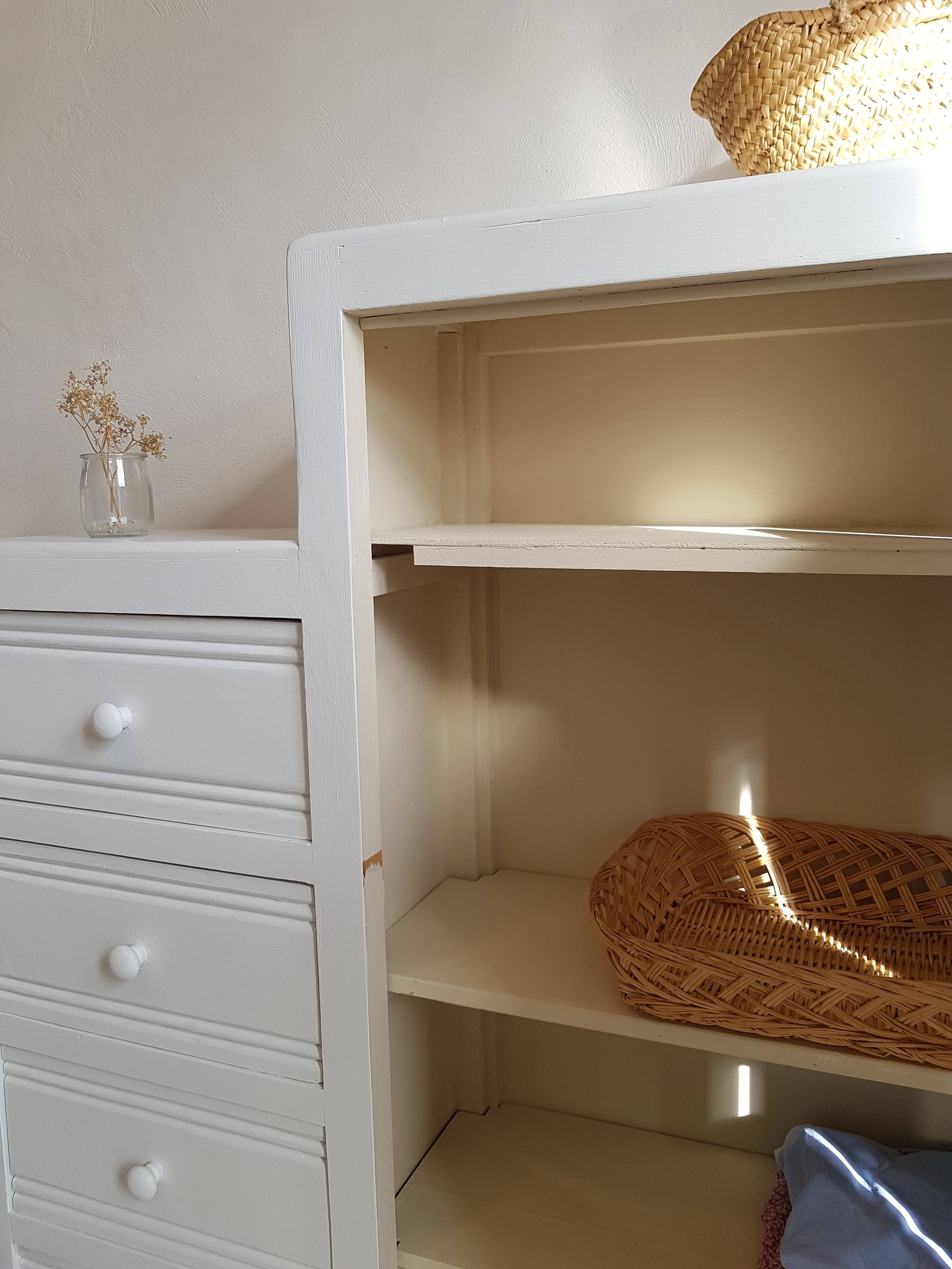 Old white asymmetrical chest of drawers
