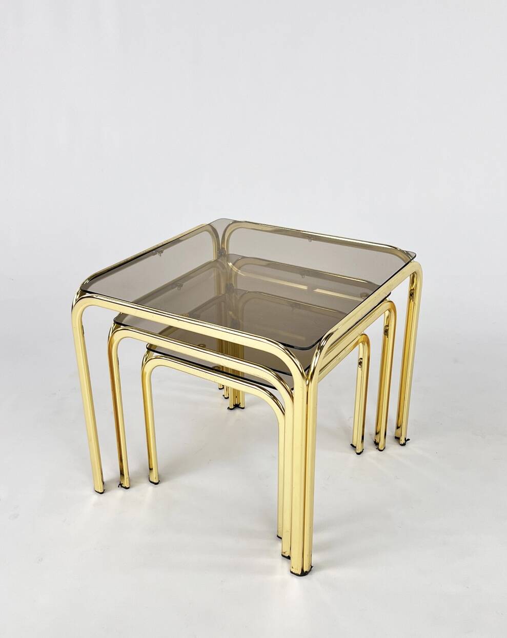 Brass and smoked glass nesting tables
