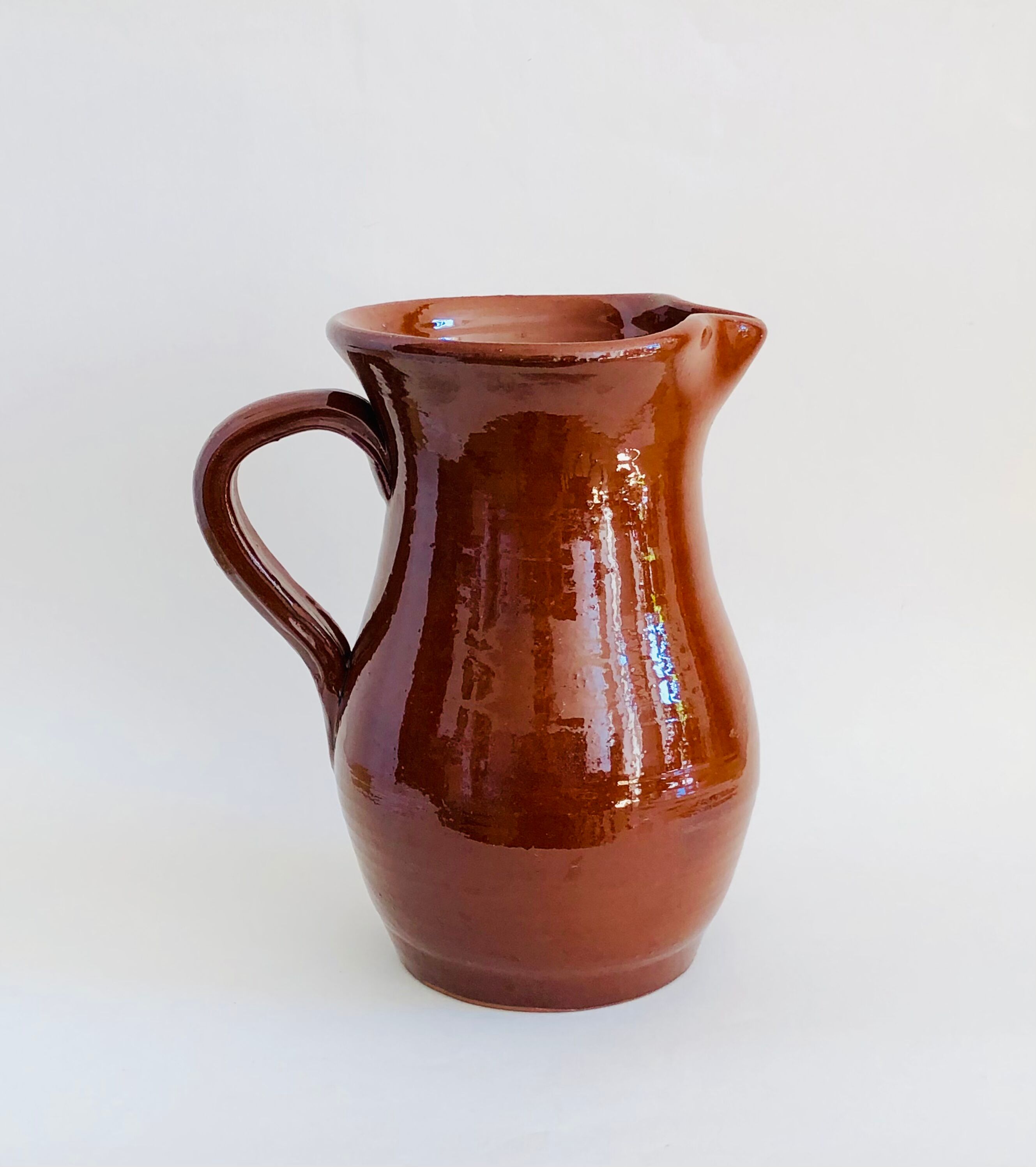 Vintage pitcher in glazed earth