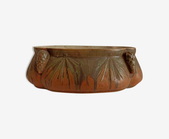 Old jewelry box decorated with pine cones