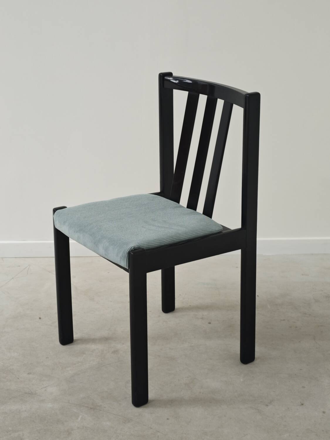 Set of 4 modernist black chairs with light blue ribbed fabric