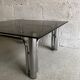 Table basse verre fumé et métal chromé années 70