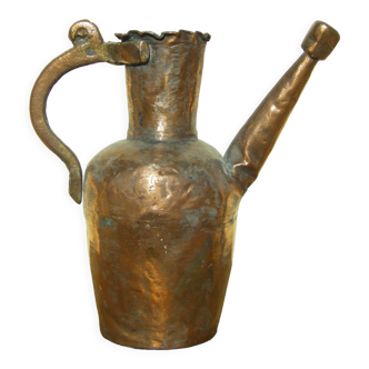 Old copper watering can