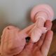 Set of 2 vintage pastel pink enamelled cast iron wall lamps