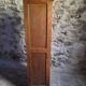 French antique wardrobe with curtain in oak, circa 1920–1930.
