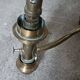 Brass chandelier with three flames.
