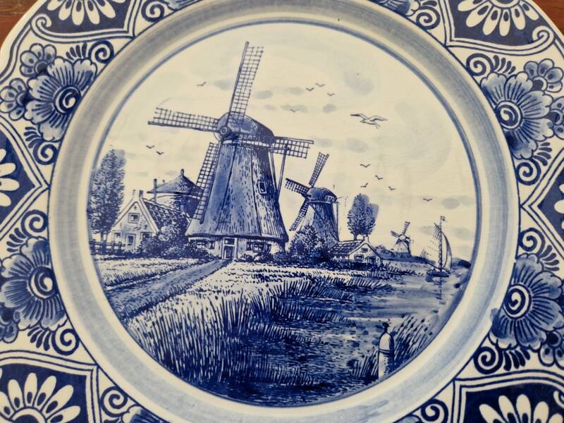 Delft Blue earthenware plate with a mill by a river decoration