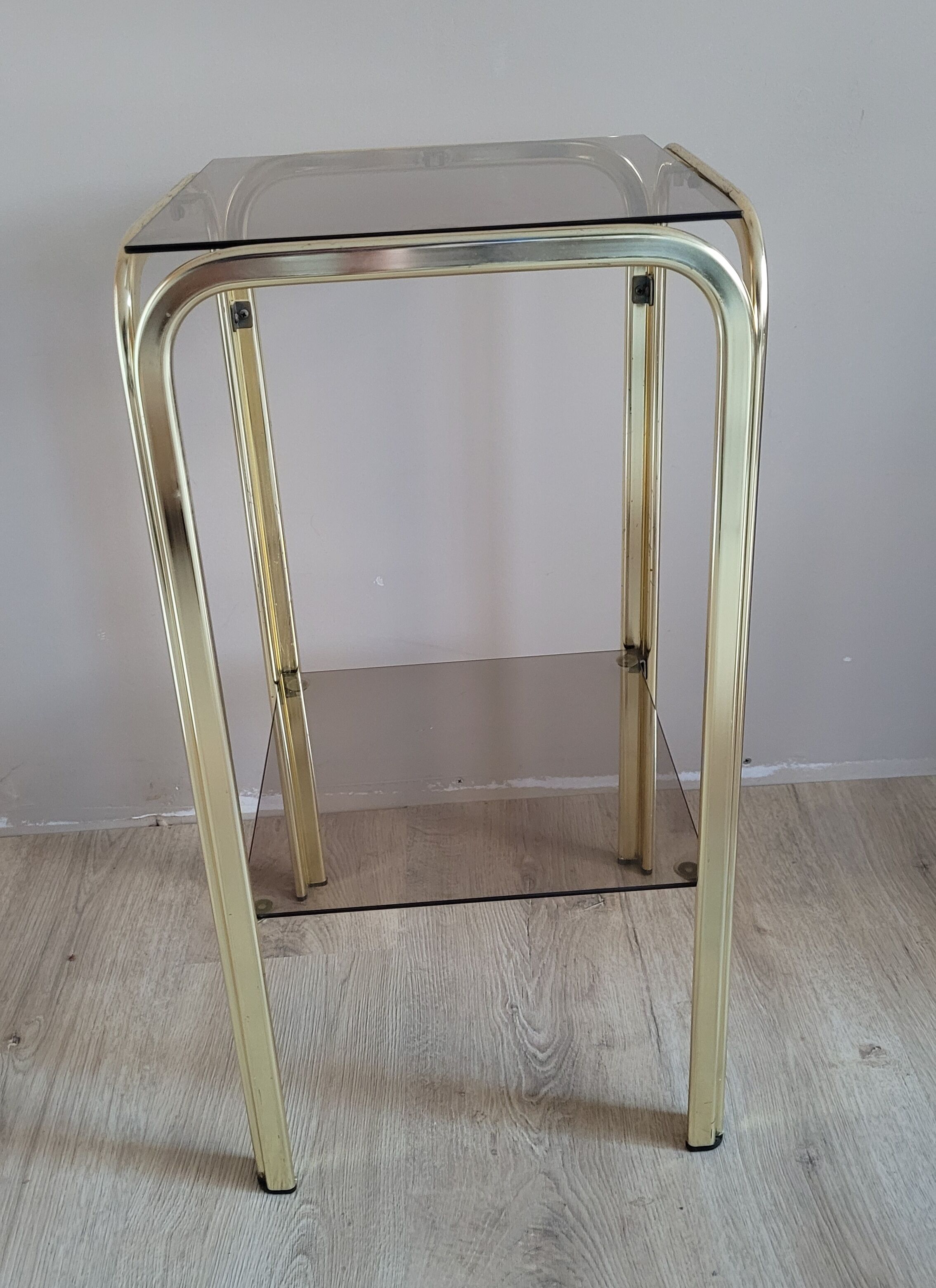Golden side table and smoked glass