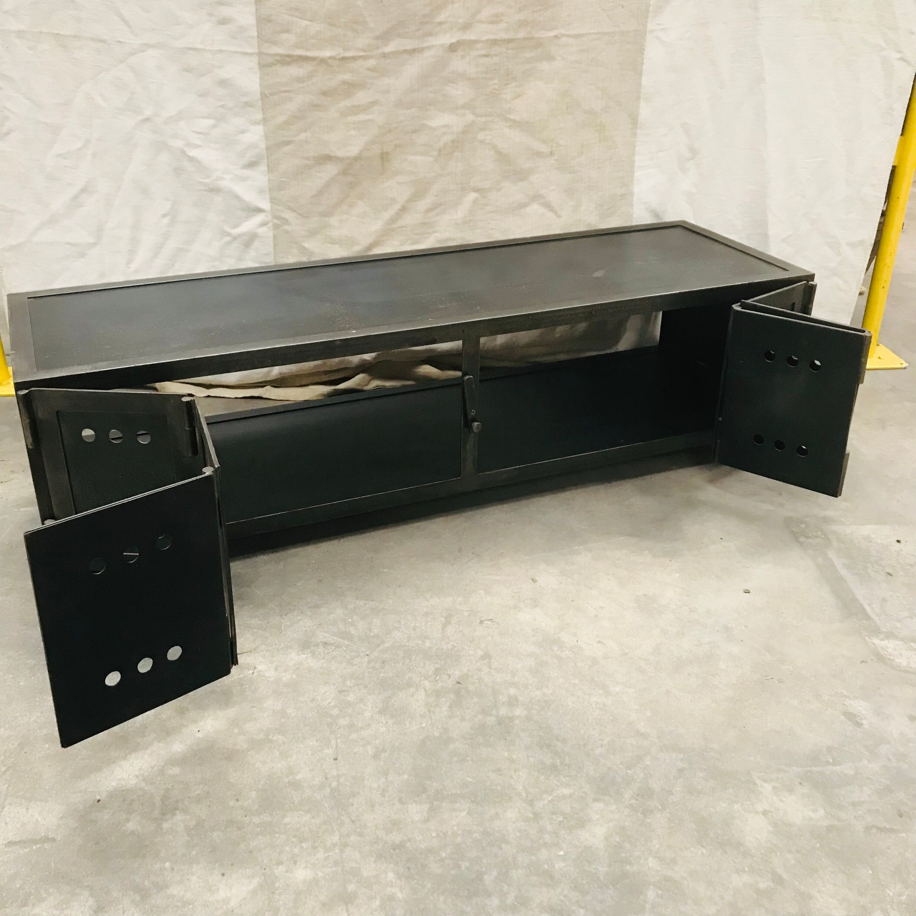 TV stand with natural steel accordion doors