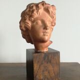 Ancient cherub bust on pedestal