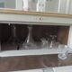 Small vintage piece of furniture sublimated in a linen shade, wooden top.