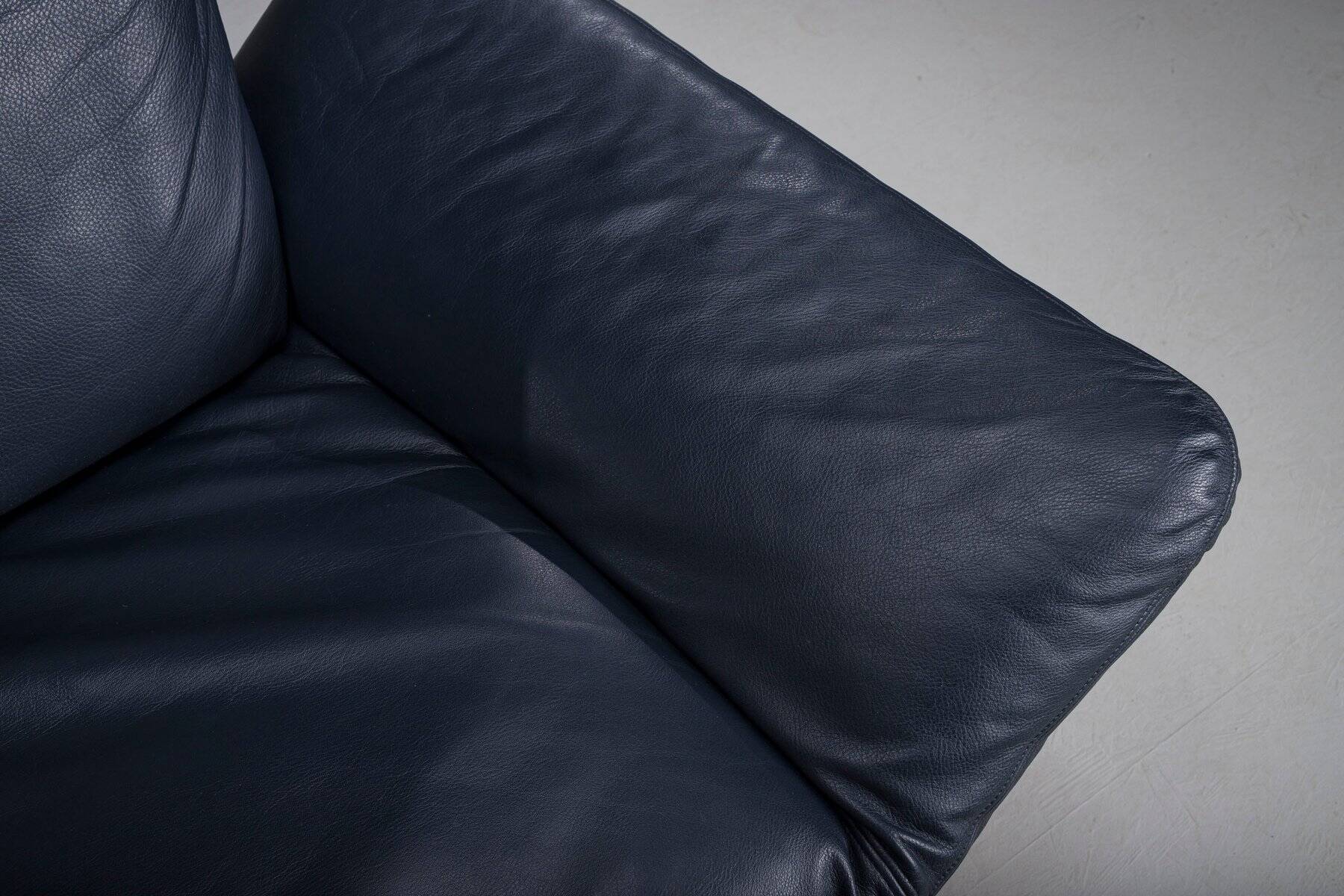 Danish teak and navy blue leather 2-seater sofa from Komfort, 1970s